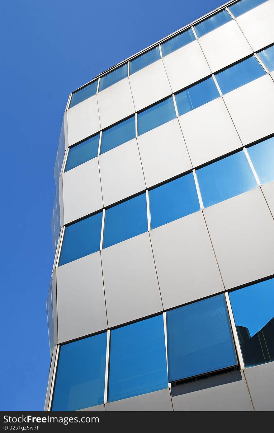 Abstract corner of an office building with reflective glass. Abstract corner of an office building with reflective glass