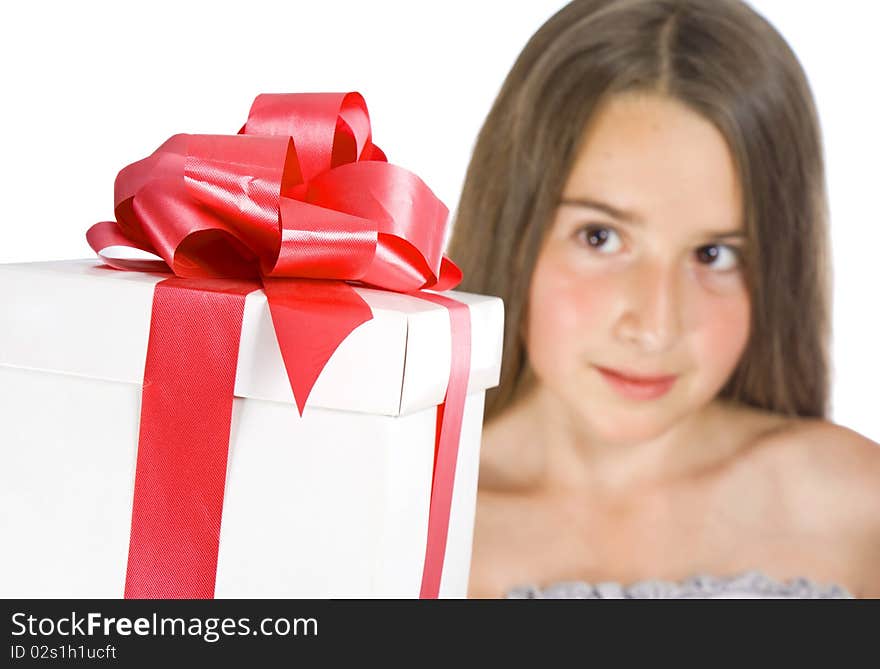 Happy girl with gift box over white