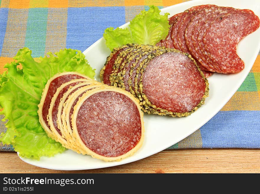 Various kinds of salami : with cheese and pepper with plate decoration. Various kinds of salami : with cheese and pepper with plate decoration