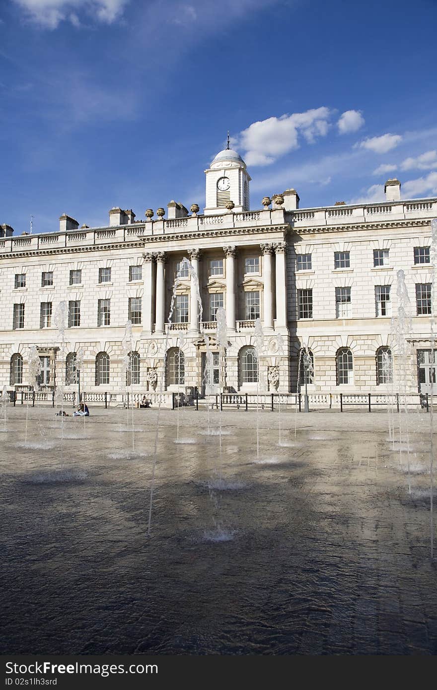 People relaxing near fountain and beautiful architecture of square from London UK Europe. People relaxing near fountain and beautiful architecture of square from London UK Europe