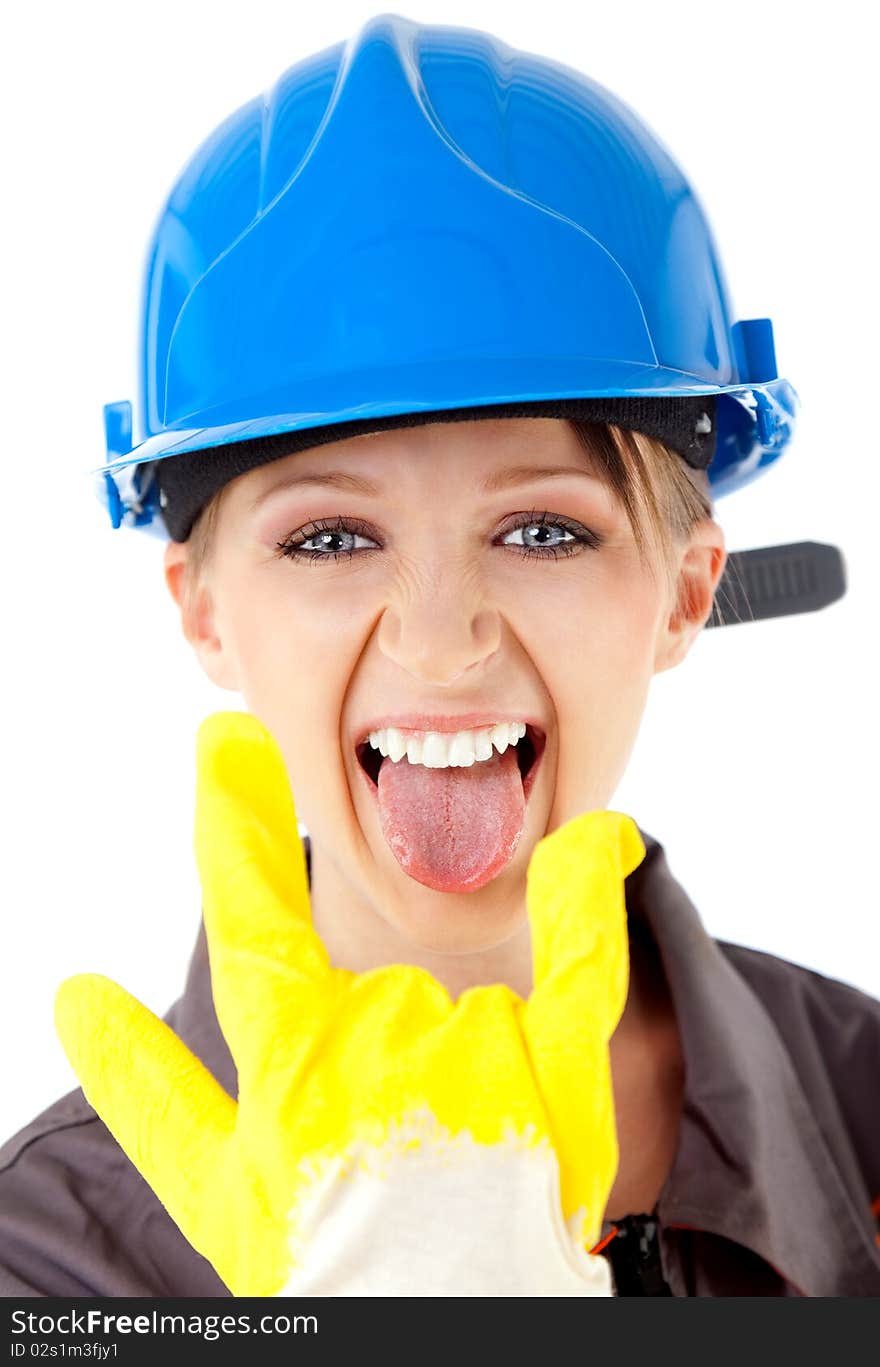 Portrait of young female construction worker with blue hardhat and yellow glove, showing rock on sign. Portrait of young female construction worker with blue hardhat and yellow glove, showing rock on sign