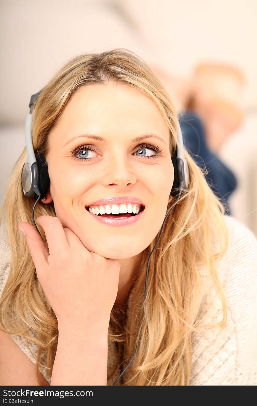 Blond girl listening to music