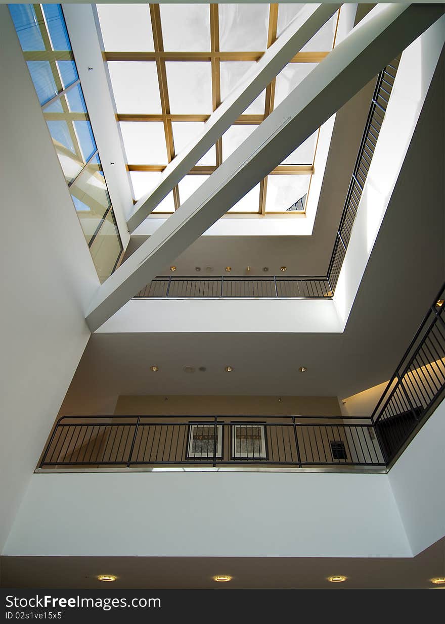 Office building interior lobby with skylight and balconies. Office building interior lobby with skylight and balconies