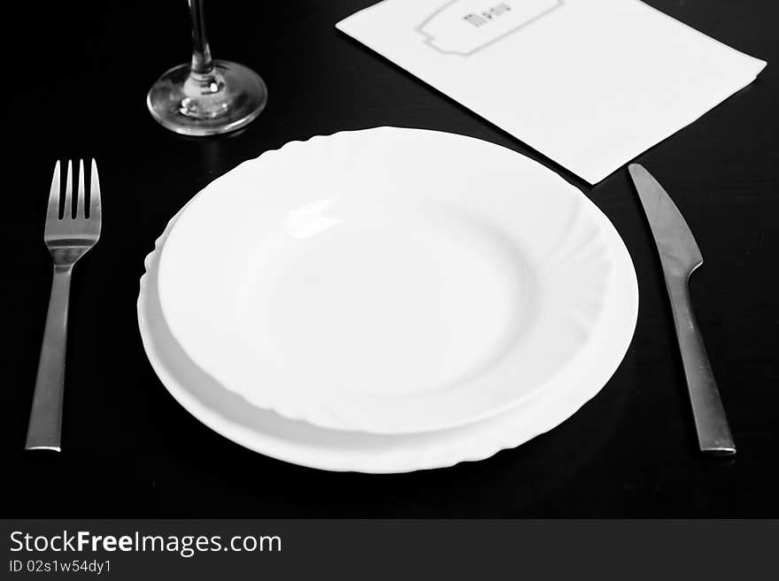 Silverware and a menu on a restaurant table