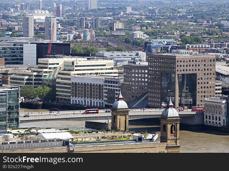 Buses Crossing Tower Bridge And Buildings