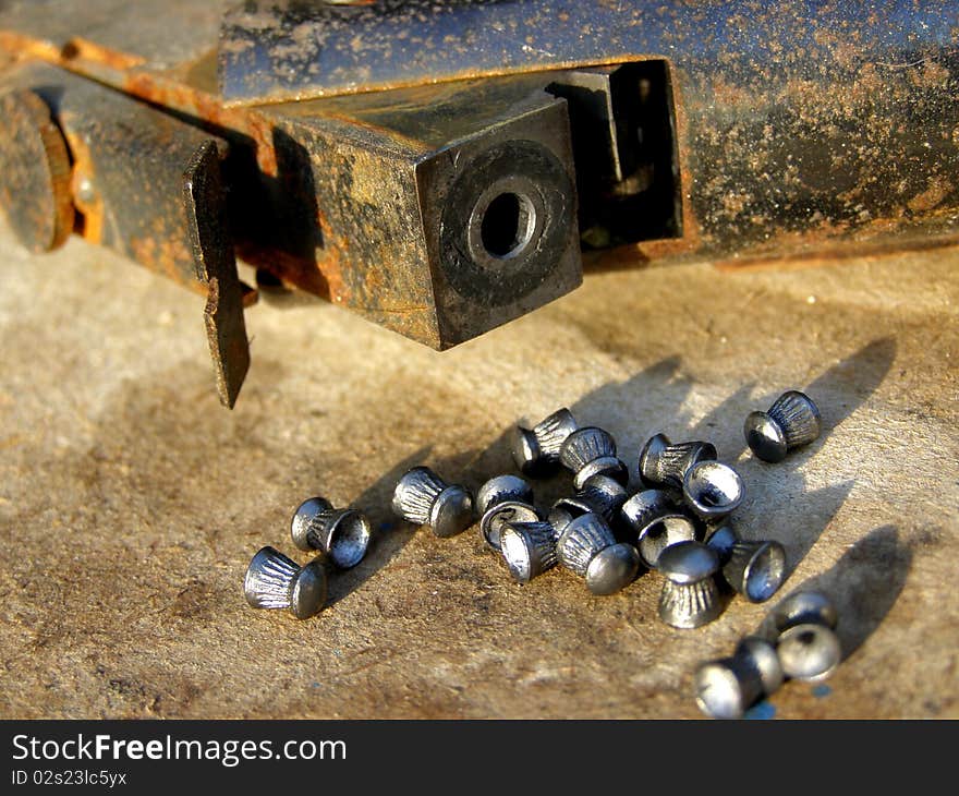 Detail photo of the airgun and airgun pallets background. Detail photo of the airgun and airgun pallets background