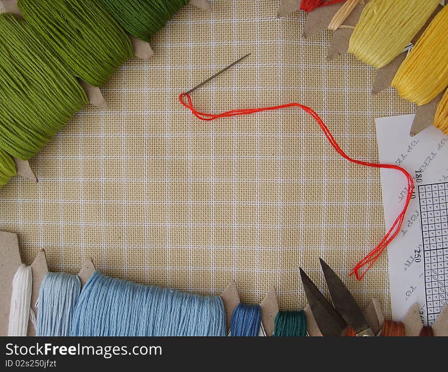 Scissors, color thread, needle and canvas for gobelins (arras). Scissors, color thread, needle and canvas for gobelins (arras)