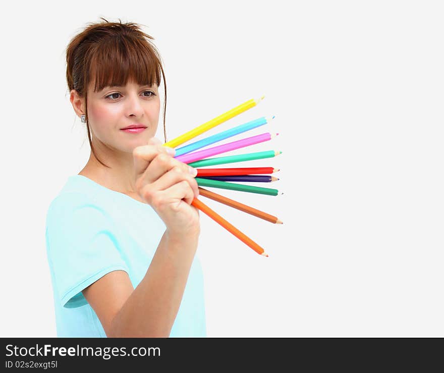 A woman holding colorful pencils isolated on a white background. A woman holding colorful pencils isolated on a white background