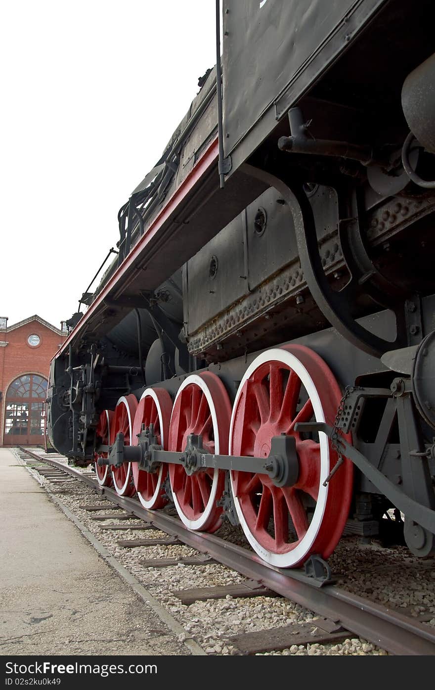 Old locomotive wheels close up. Steam train.