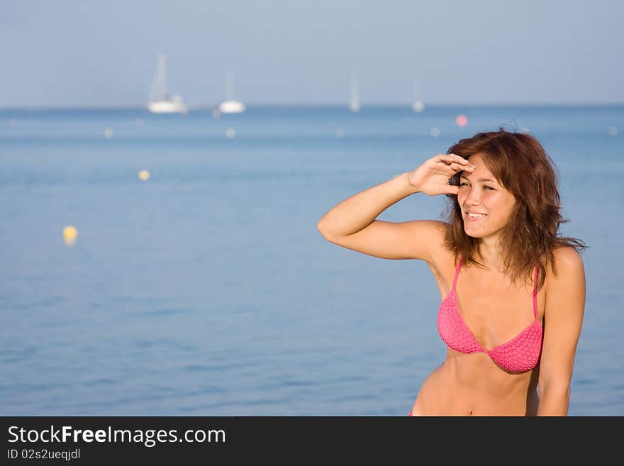 Beautiful dark-haired girl looks into the distance