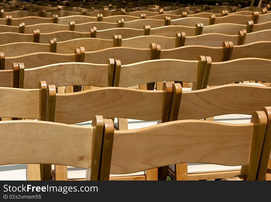 Rows of wooden chairs background image. Rows of wooden chairs background image