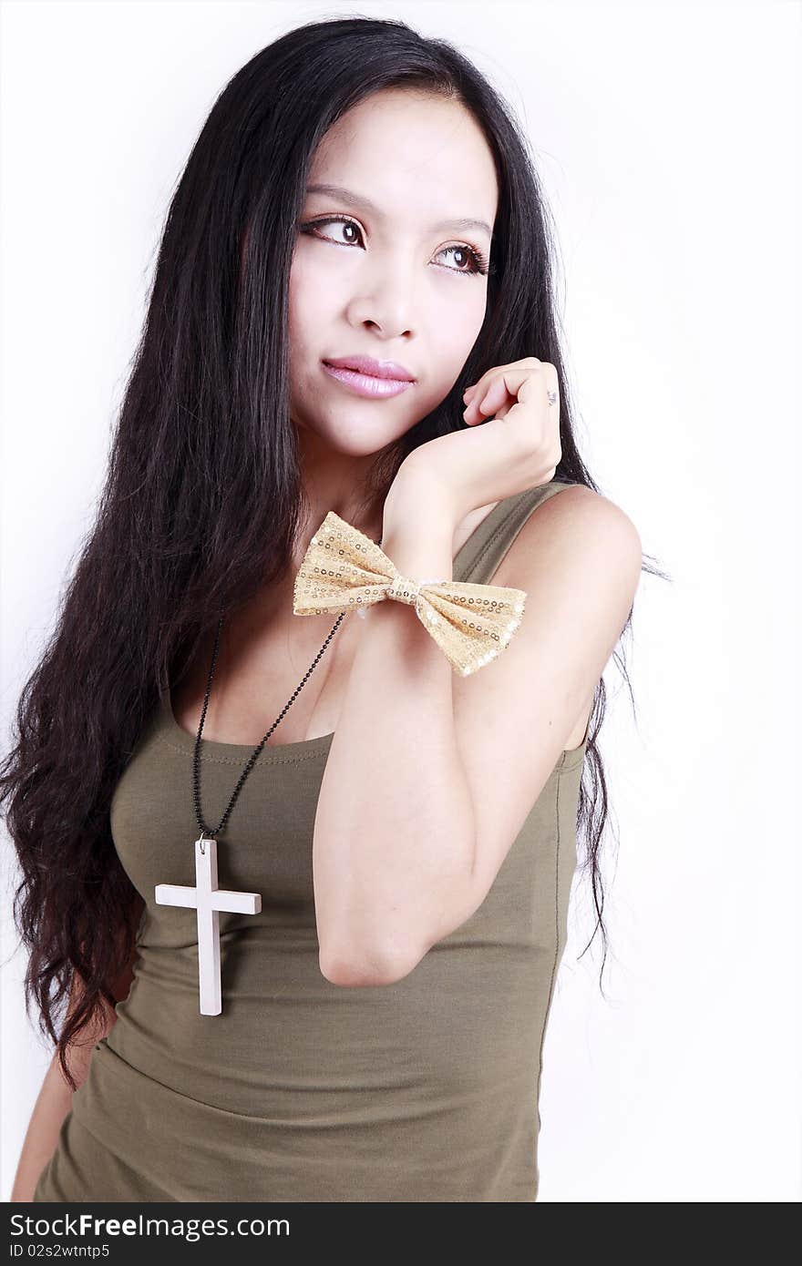 Young Chinese woman with long hair posing on white.