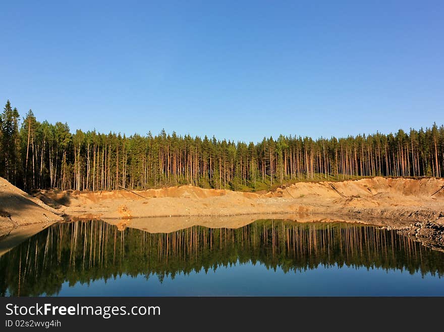 Water of an open-cast mine at summer