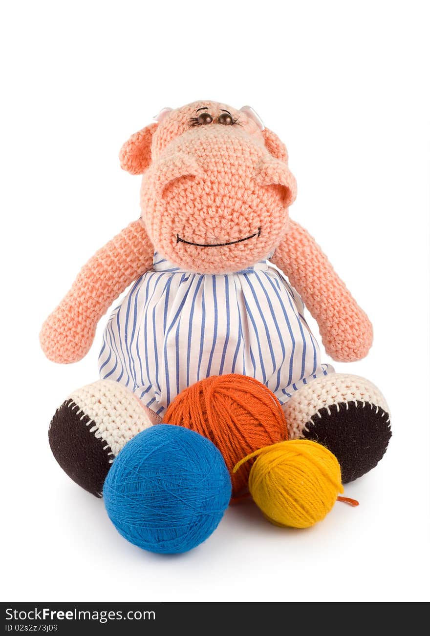 Soft toy hippopotamus and balls of thread