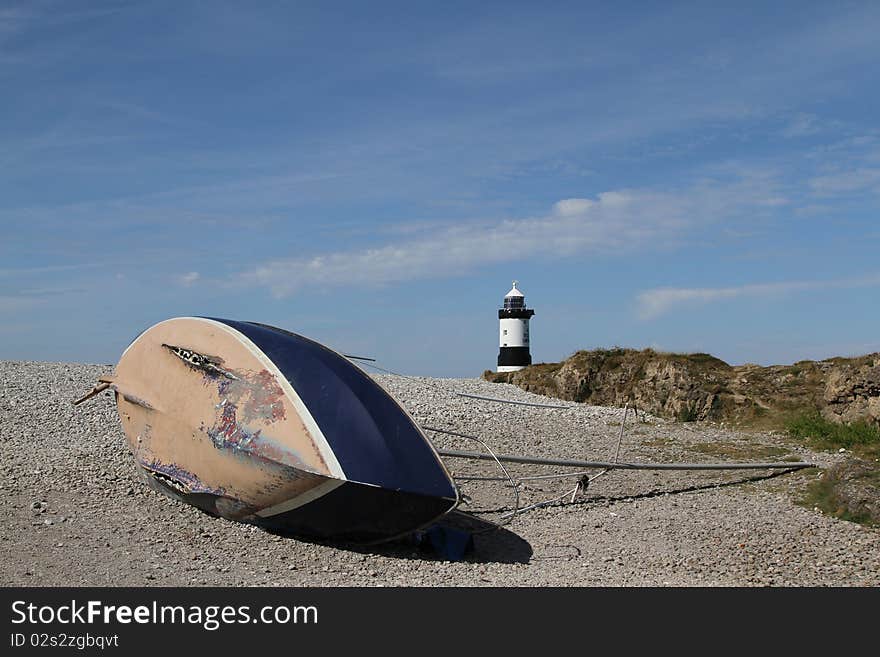 Wrecked yacht and lighthouse.