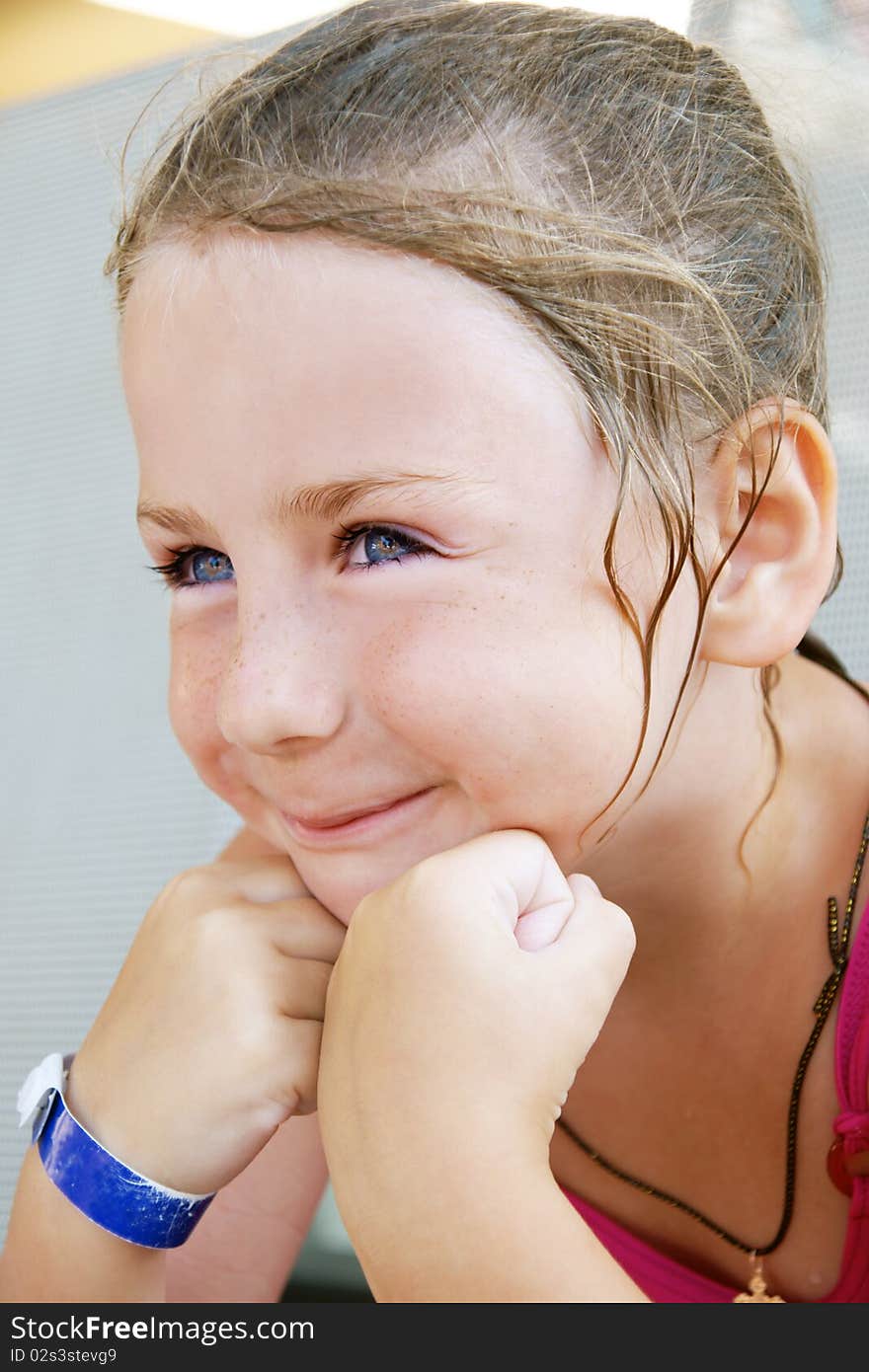 Portrait of pretty smiling girl with blue eyes, outdoor shot