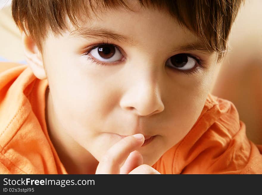 Portrait of beautiful little thoughtful boy, studio shot. Portrait of beautiful little thoughtful boy, studio shot