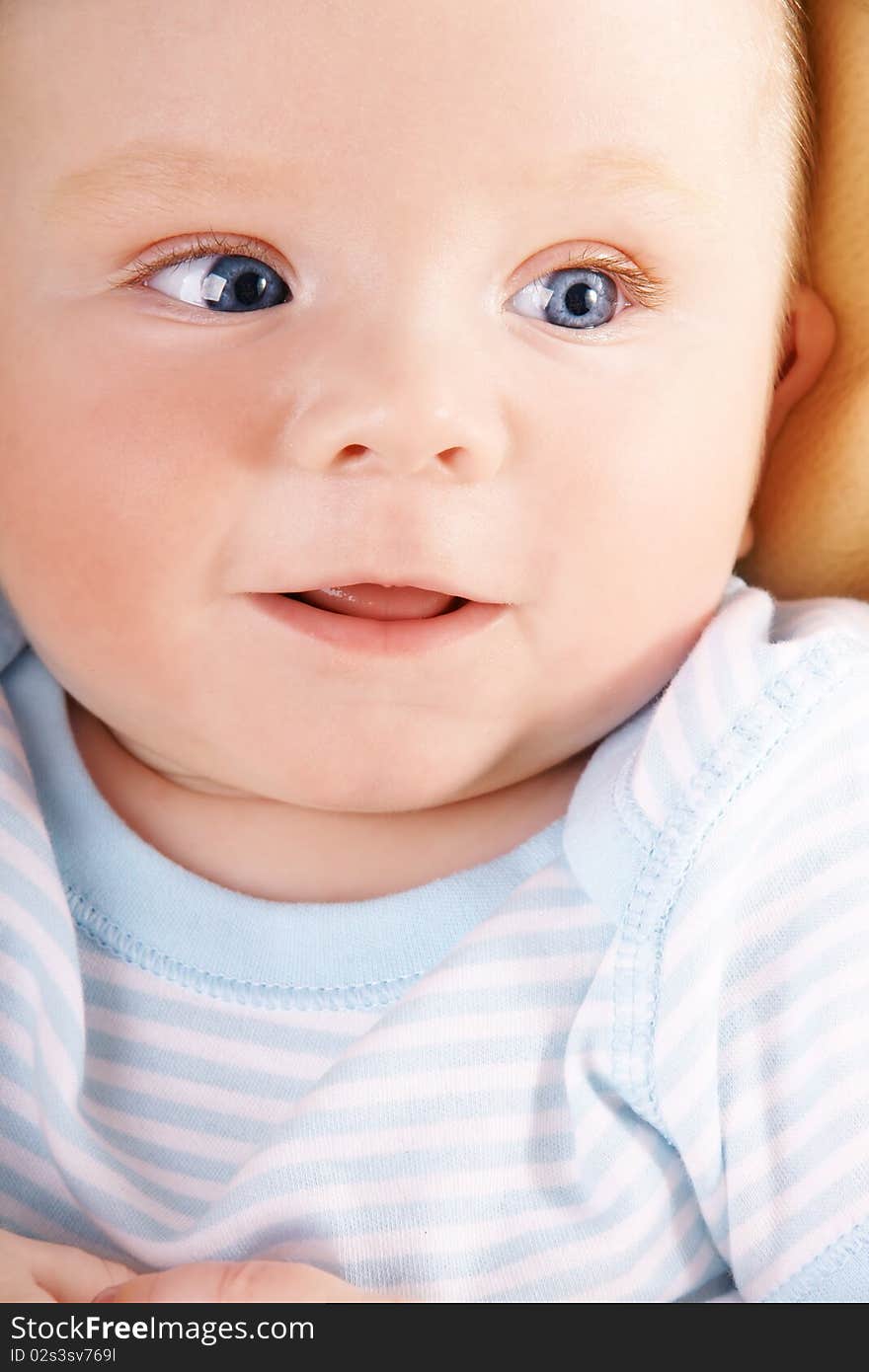 Portrait of pretty happy blue-eyed smiling baby-boy, studio shot. Portrait of pretty happy blue-eyed smiling baby-boy, studio shot