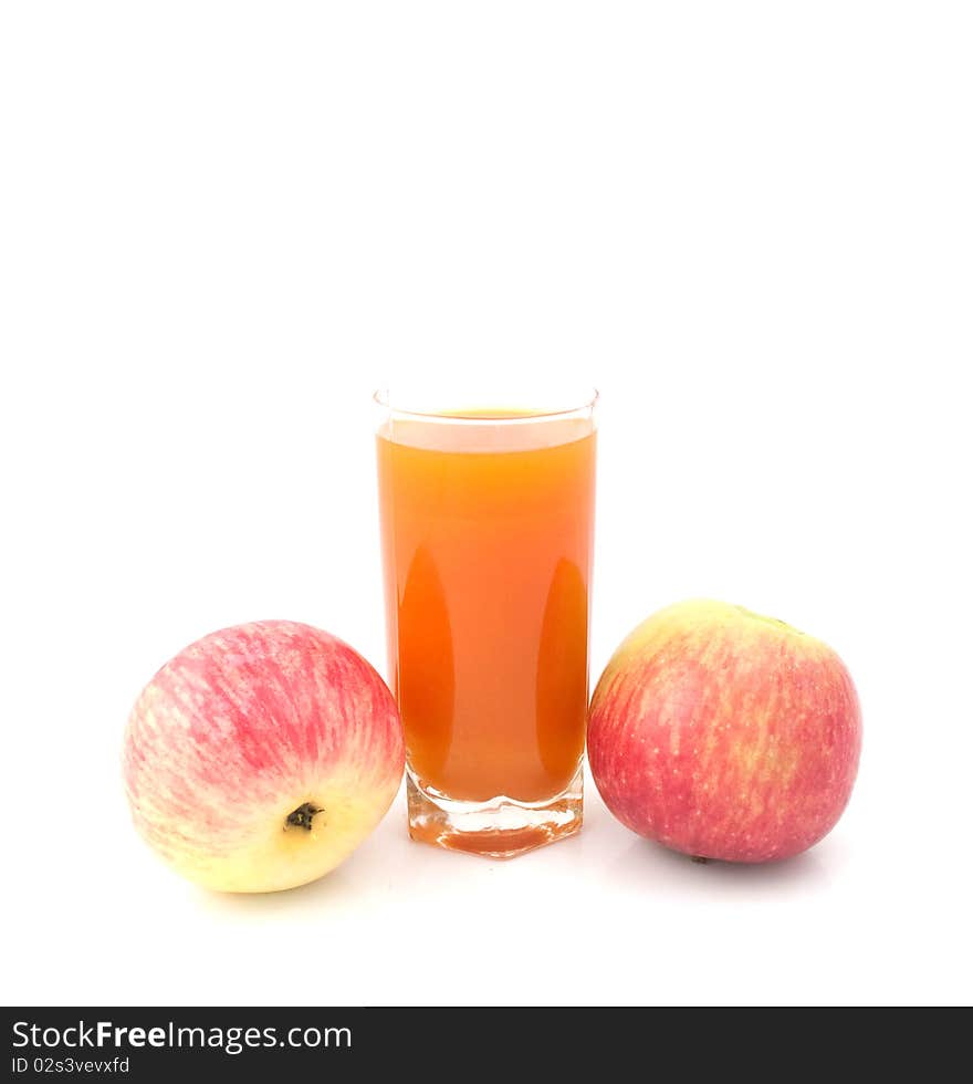 Glass of juice with  apples on a white background