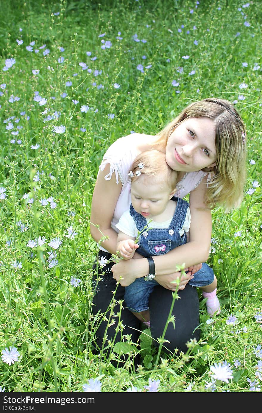 Mother and daughter on the grass