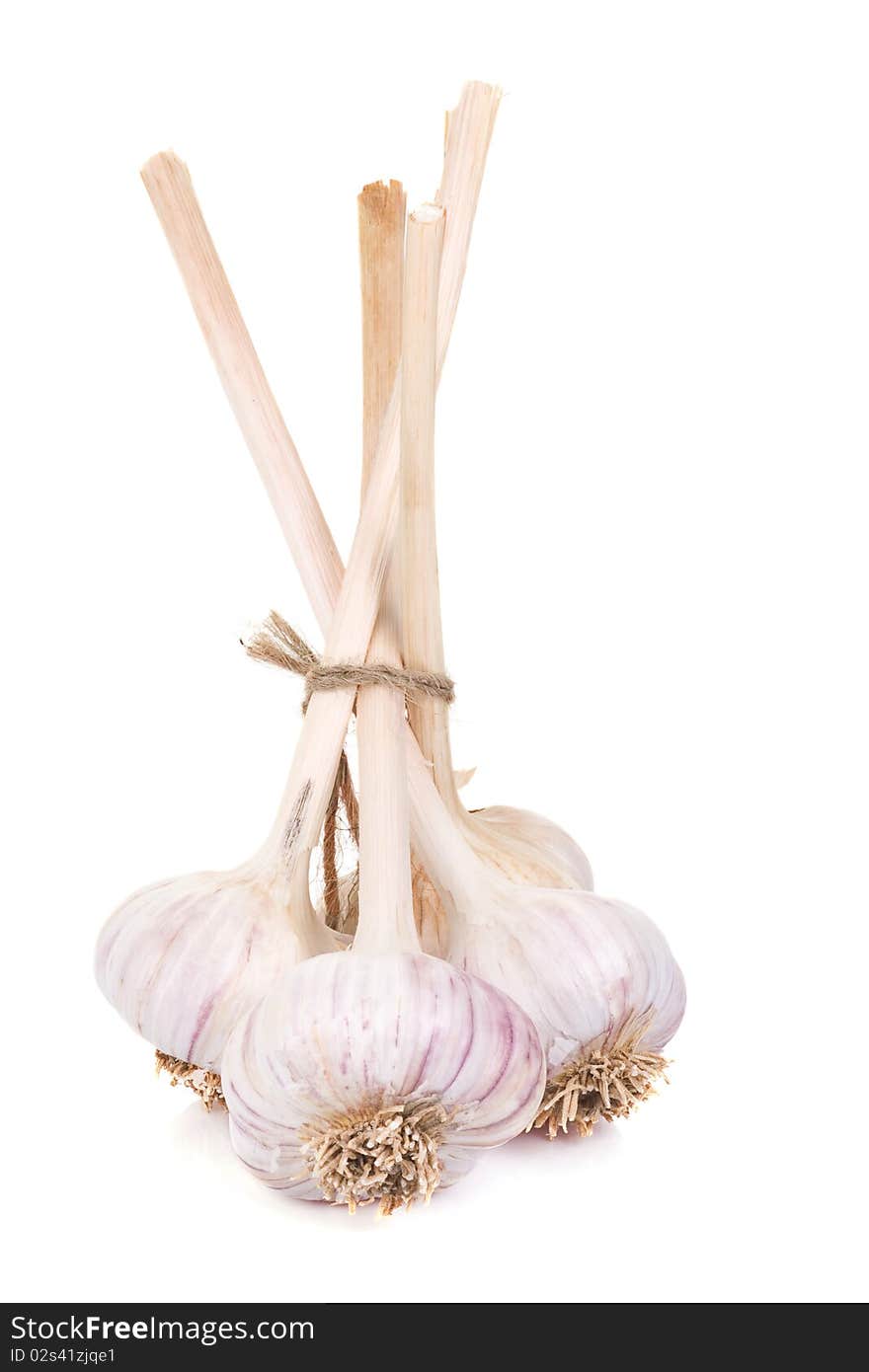 Vertical image of isolated garlics