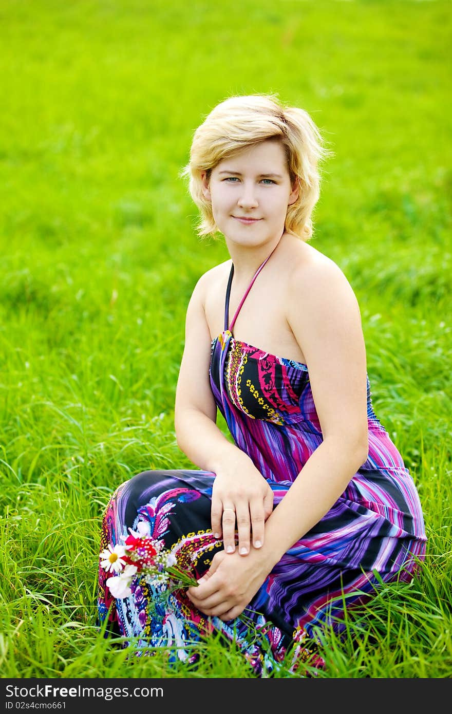 Young beautiful girl on a meadow