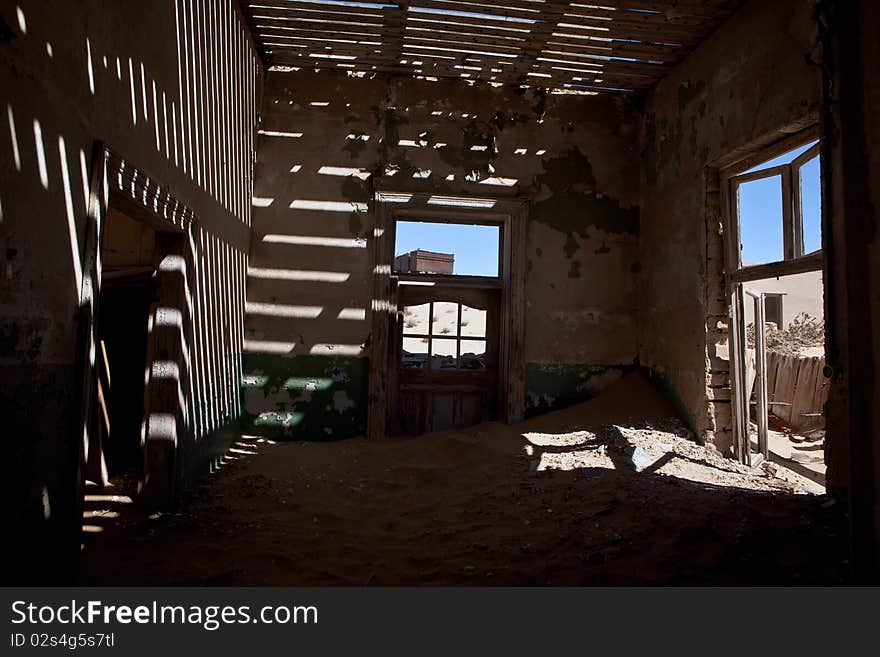 Old ruin in the abandoned diamond town Kolmanskop in Namibia