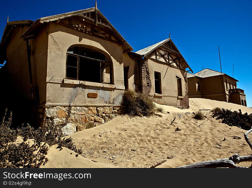 Old ruin in the abandoned diamond town Kolmanskop in Namibia