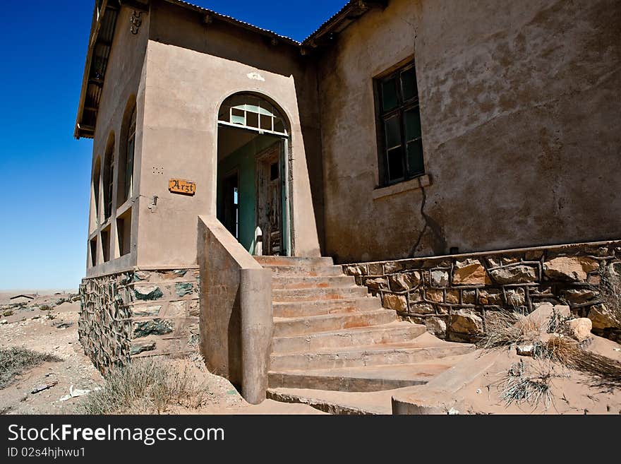 Old ruin in the abandoned diamond town Kolmanskop in Namibia