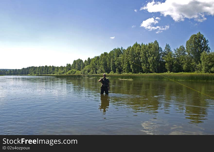 Photo of the fisherman on the river