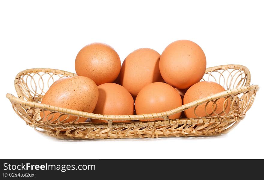 Eggs in a basket on white background