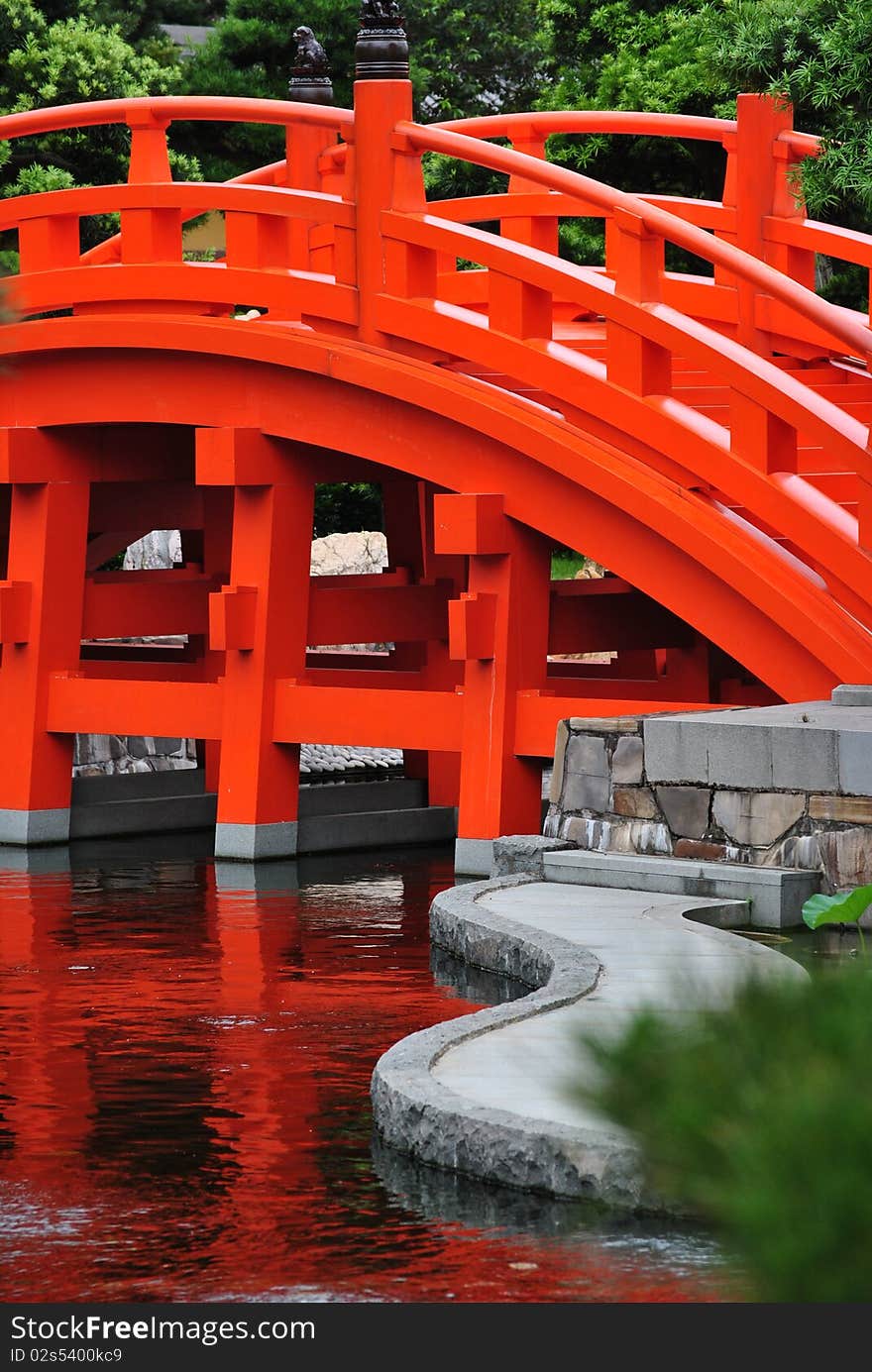 Bright colored bridge taken in Hong Kong's Nan Lian Garden. The bridge was built in a Tang Dynasty style. Bright colored bridge taken in Hong Kong's Nan Lian Garden. The bridge was built in a Tang Dynasty style.