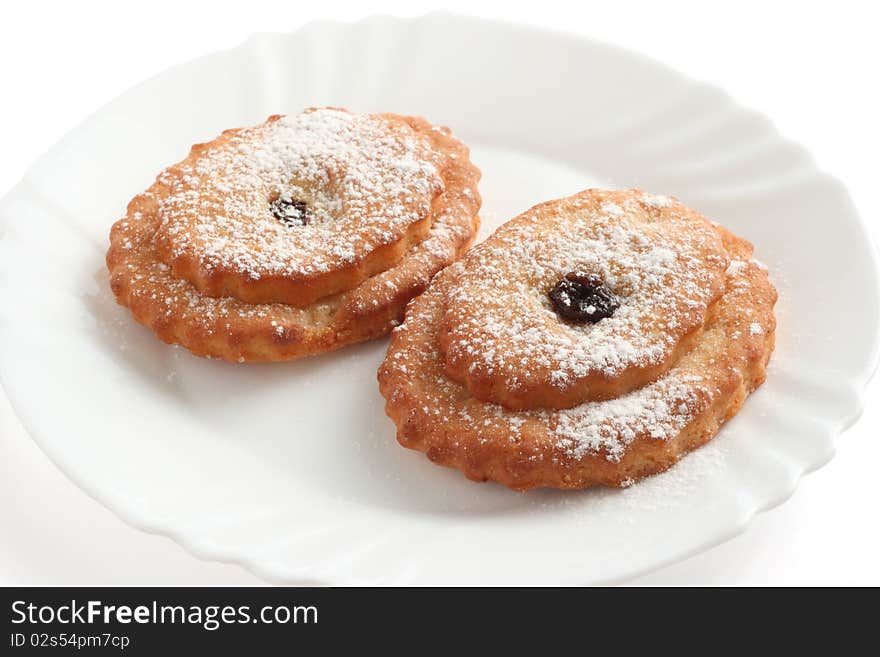 Cookies with castor sugar on a plate. Cookies with castor sugar on a plate