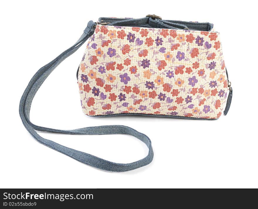 Textile female bag with floral ornament. Isolated on white background. Textile female bag with floral ornament. Isolated on white background