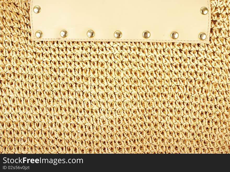 Knitted textile texture with lether element and rivets. Knitted textile texture with lether element and rivets