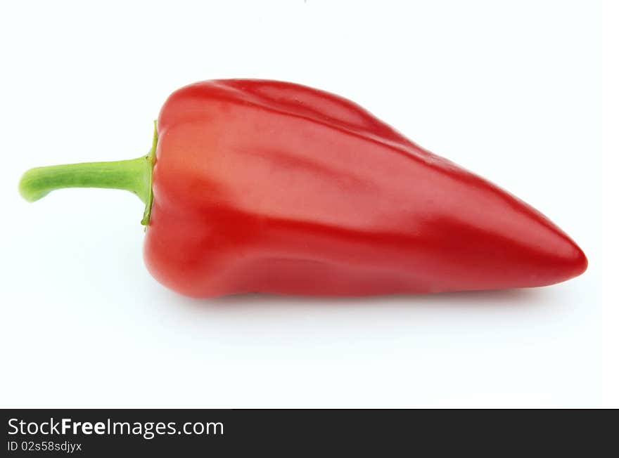 One red hot pepper on a white background. One red hot pepper on a white background