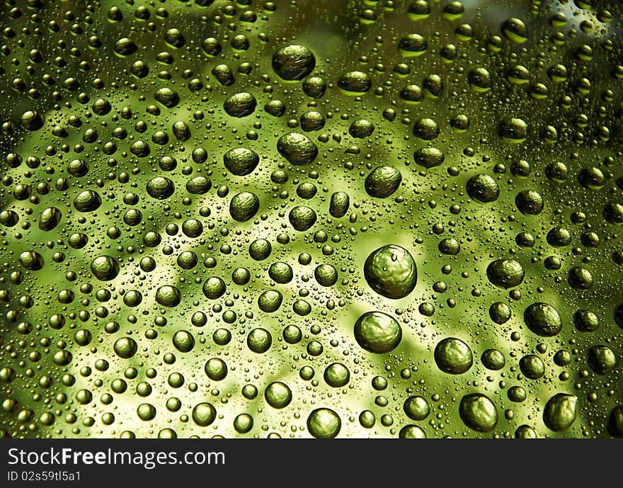 Many little water drops on the glass(yellow). Many little water drops on the glass(yellow)