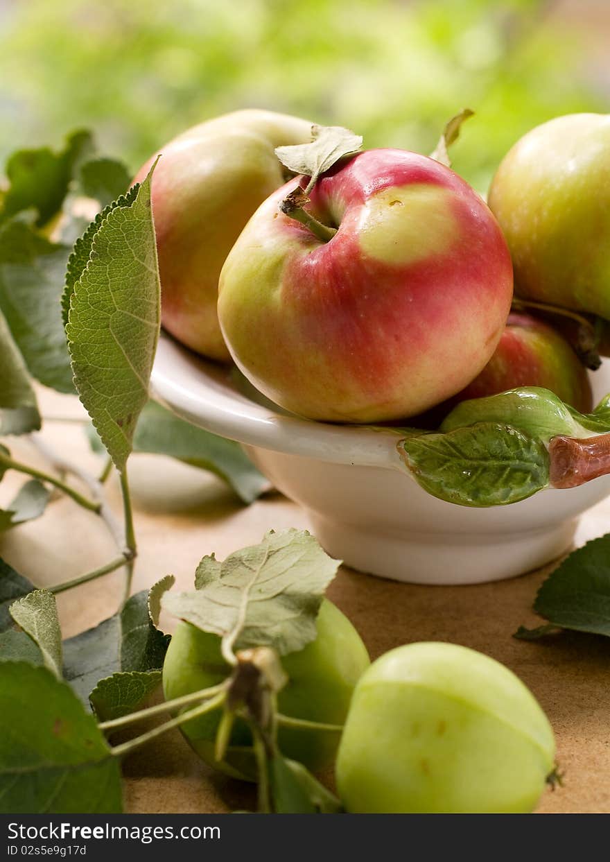 Bowl of fresh ripe apples on table. Bowl of fresh ripe apples on table