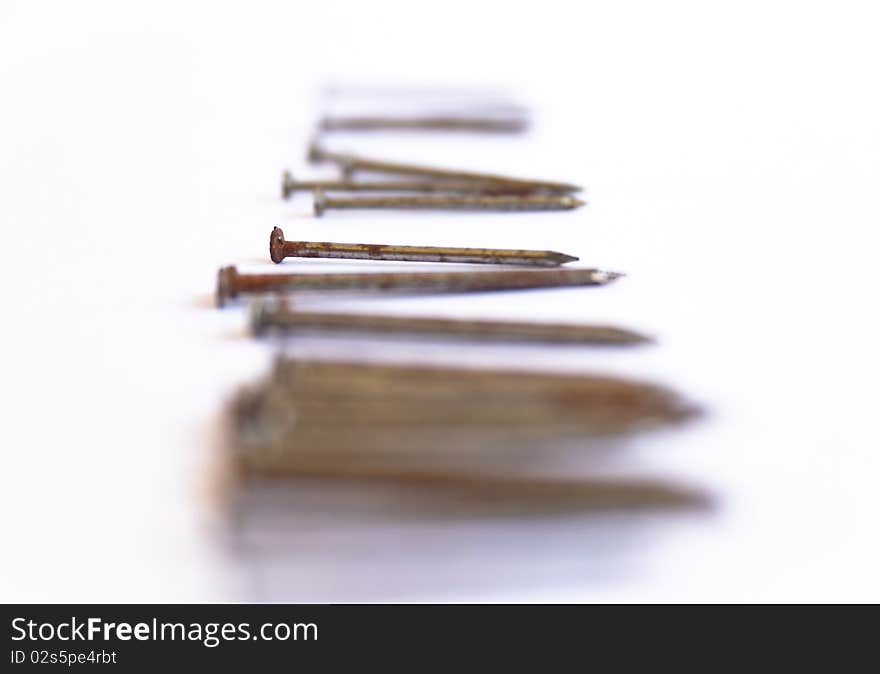 Several nails rust on a white background. Several nails rust on a white background.