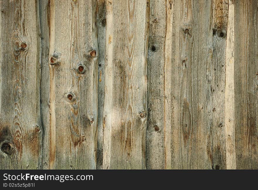 Old weathered wooden fence background. Old weathered wooden fence background