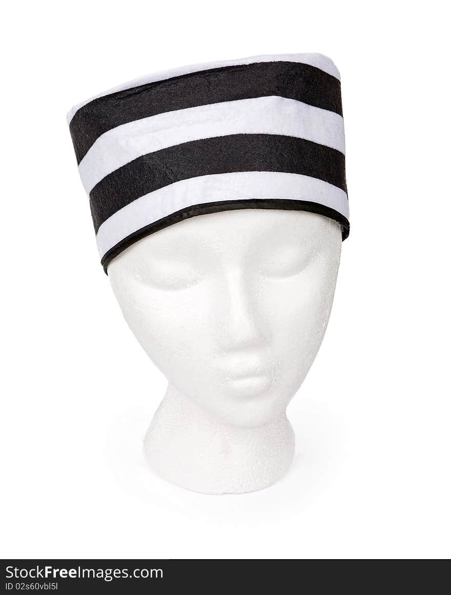 Old fashioned black and white striped prisoner hat isolated on white. Resting on a model head for proper perspective. Contains a clipping path for easy extraction.