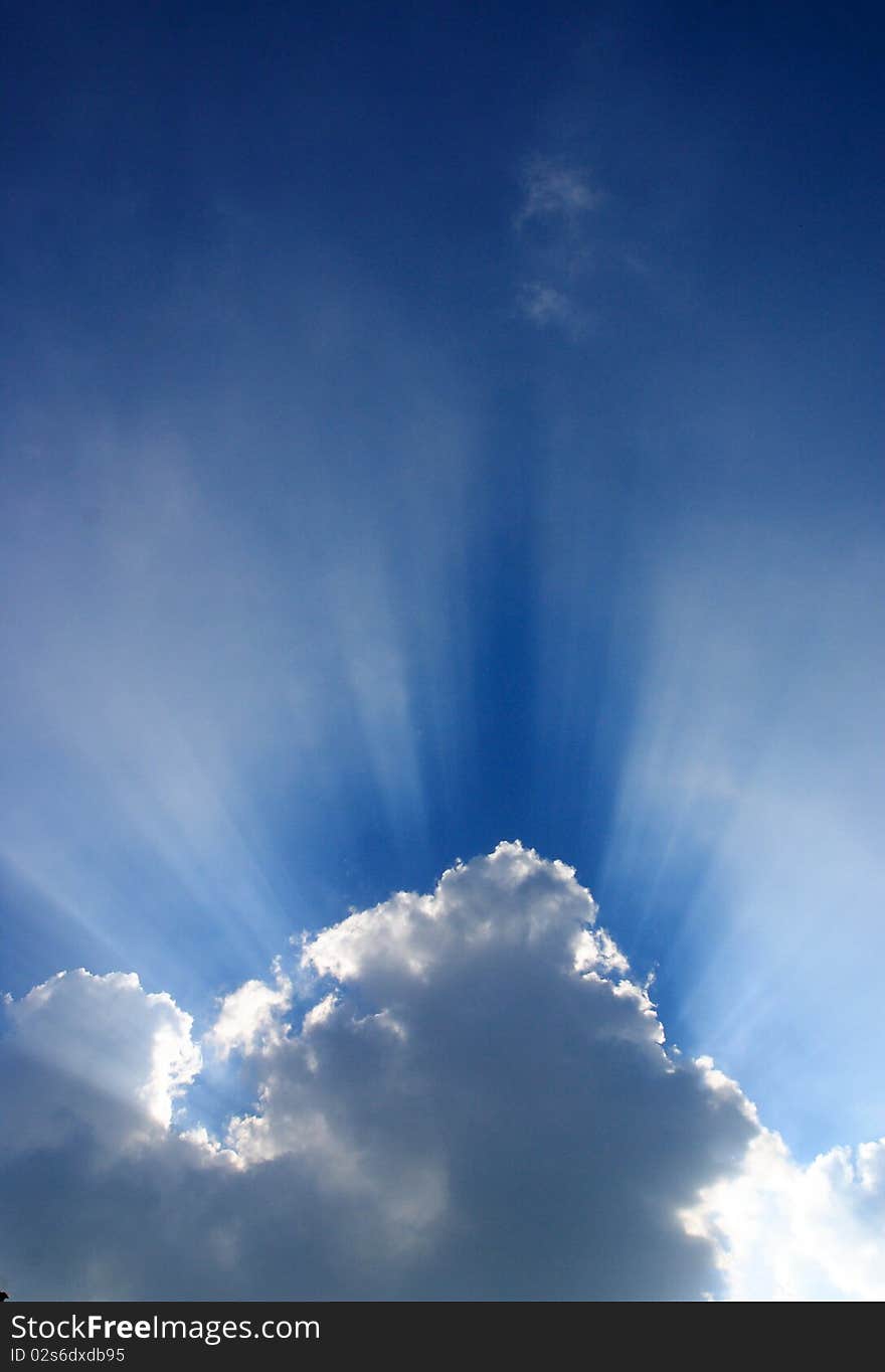 Blue sky, white clouds, solar light shining in all directions, beautiful sky. Blue sky, white clouds, solar light shining in all directions, beautiful sky