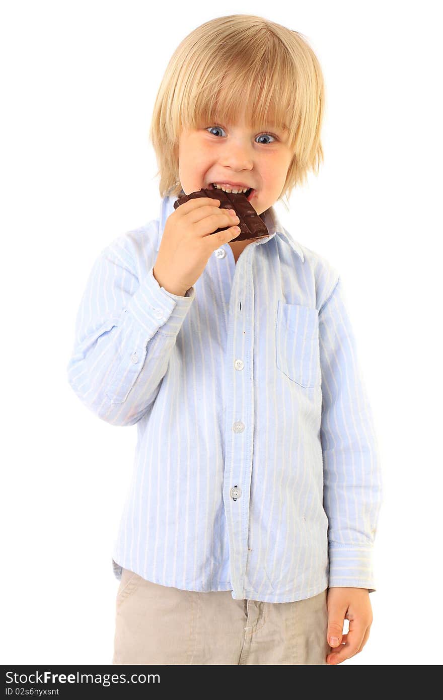 Happy kid eating chocolate isolated on white