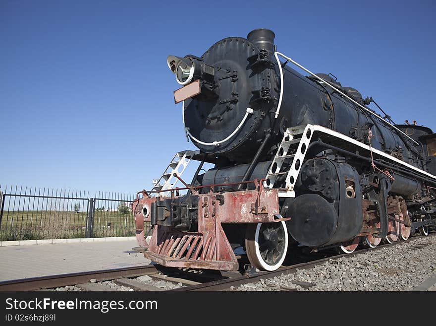 The old locomotive train running outside. The old locomotive train running outside