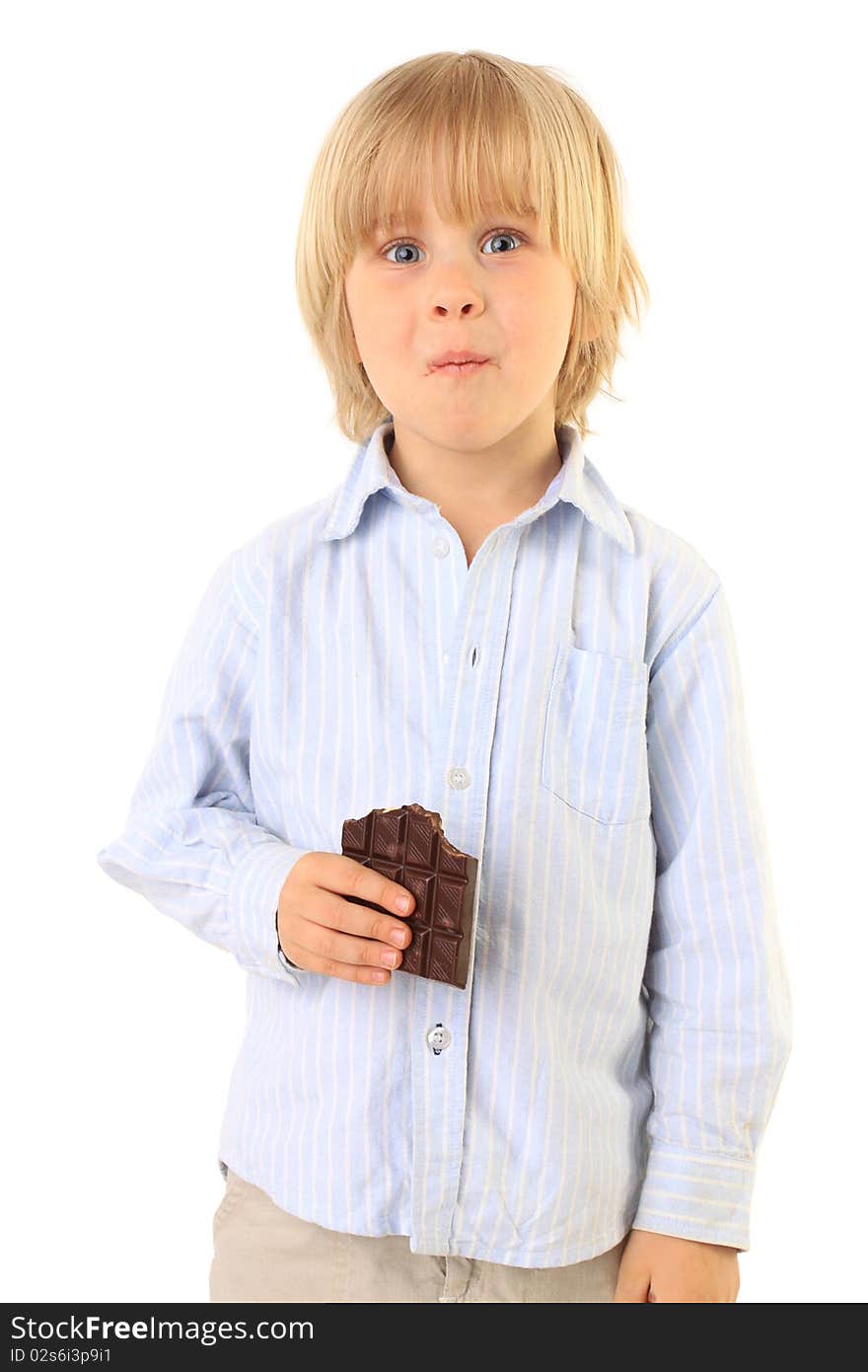 Happy child eating chocolate isolated on white. Series. Happy child eating chocolate isolated on white. Series