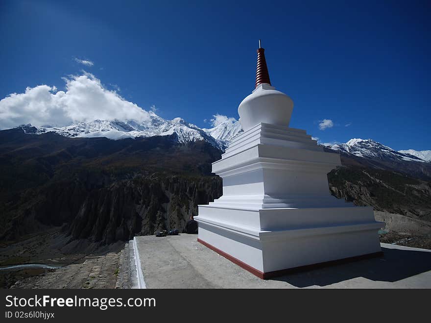 White stupa in the mountains of Nepal in the around Annapurna trek in Nepal. White stupa in the mountains of Nepal in the around Annapurna trek in Nepal