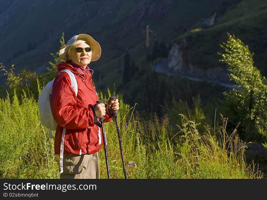 Old woman with mountains flowers. Old woman with mountains flowers