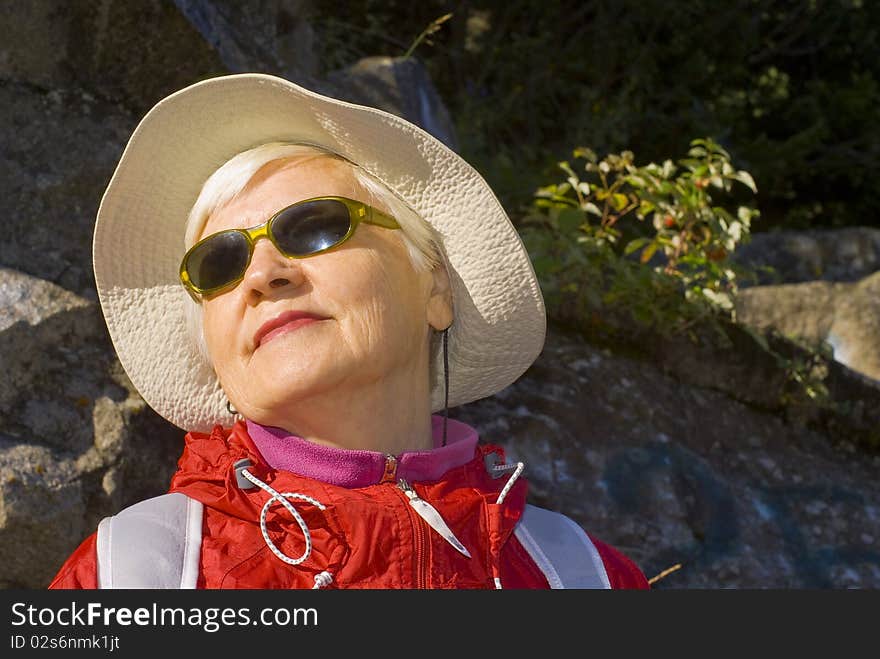 Old woman with mountains flowers. Old woman with mountains flowers