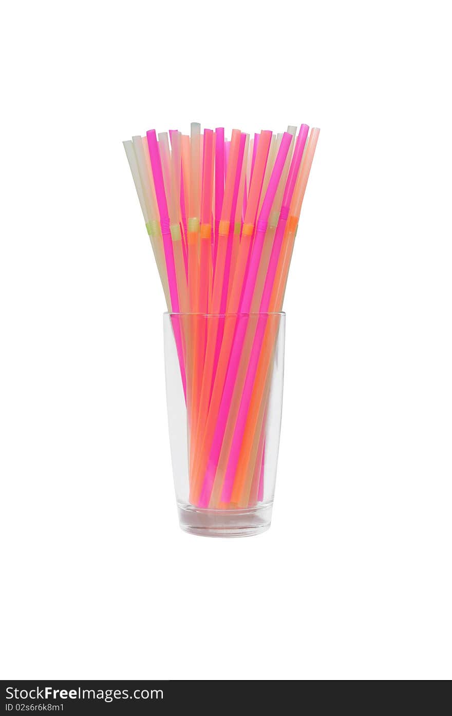 Isolated glass with many bright drinking straws in it. Isolated glass with many bright drinking straws in it