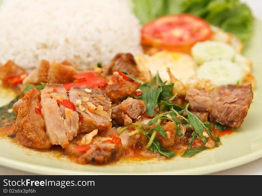 Crunchy pork fried with basil leaf and egg. Crunchy pork fried with basil leaf and egg